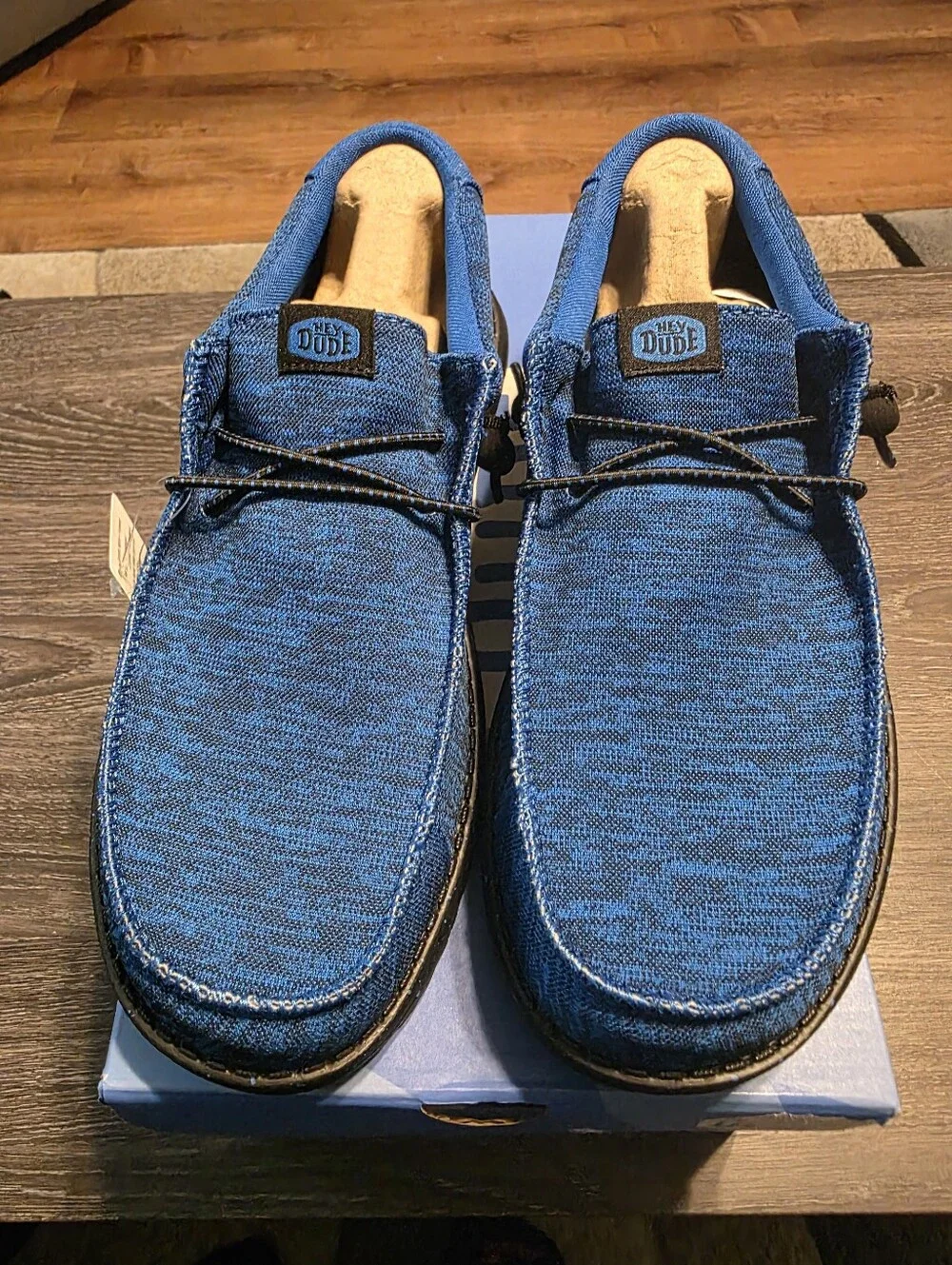 Hey Dude Men's Blue Casual Moccasin Shoes With Black Soles And Logo.